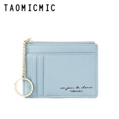 a blue card case with a keychain hanging from it's front pocket