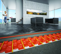 a woman is standing in an office with red and yellow lines going through the floor