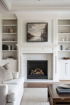 a living room filled with furniture and a fire place in front of a white fireplace