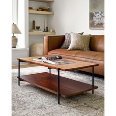 a living room with a leather couch and coffee table