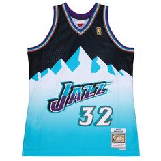 a jersey with the number 32 on it and mountains in blue, black and white