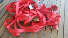 red ribbon laying on top of a wooden table