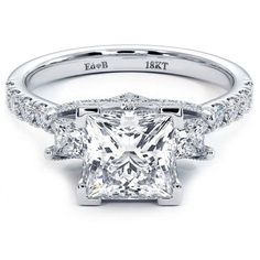 a princess cut diamond engagement ring with side stones