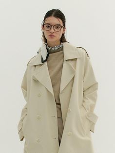 This is a feminine and modern trench coat by MOAT that is made out of high quality and sturdy material. With distinctive mood of the design and comfortable wear, you can style it for your casual daily outfit.- Dropped shoulder and oversized silhouette- A line fit with back pleats- Trendy and feminine mood Chic Oversized Solid Pea Coat, Oversized Modern Pea Coat, Oversized Beige Chic Pea Coat, Chic Oversized Beige Pea Coat, Oversized Beige Modern Outerwear, Chic Oversized Gabardine Outerwear, Modern Trench Coat, Japanese Trench Coat, Spring Single-breasted Gabardine Pea Coat