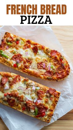 two slices of pizza sitting on top of a piece of wax paper next to each other