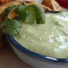 a bowl filled with guacamole and chips