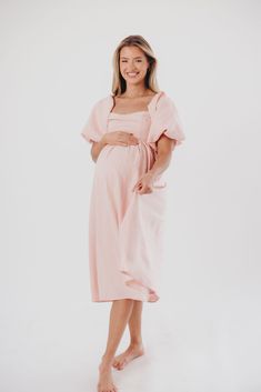 The Hamilton is everything you're looking for in a midi dress - charming, sophisticated, and absolutely flattering. It features premium quality details, like a sweetheart neckline and gorgeous balloon sleeves that can be worn on or off the shoulder. It's an unforgettable choice for every body type, and extra-comfy for expecting mamas! The best part? You can wear this beauty long after your sweet baby arrives! Available in multiple colorways. FIT: Runs true to size. Features a smocked back panel for comfort. This dress is roomy in the waist and will accommodate early maternity in your true size, but consider sizing up if you are in advanced pregnancy. MATERIAL: GARMENT DETAILS: Empire-waisted midi dress, with sweetheart neckline and statement balloon sleeves that can be worn on or off the s Spring Midi Dress With Balloon Sleeves And Ruched Detail, Feminine Dresses With Gathered Sleeves And Square Neck, Feminine Square Neck Dress With Gathered Sleeves, Feminine Pleated Sleeve Dress For Date Night, Feminine Dress With Pleated Sleeves For Date Night, Feminine Ruched Dress With Balloon Sleeves, Pink Ruched Dress With Balloon Sleeves, Pink Ruched Dresses With Balloon Sleeves, Knee-length Midi Dress With Gathered Sleeves For Date Night