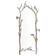 a mirror with branches and leaves on the bottom, in front of a white background