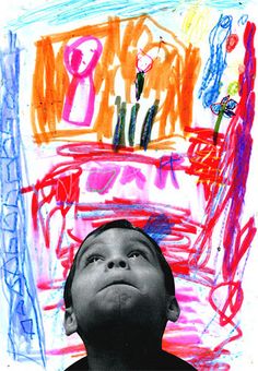 a young boy looking up in front of a drawing