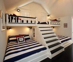 two bunk beds with stairs in a bedroom