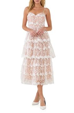 Make an enchanting impression at any occasion in this romantic lace midi dress wrapped in embroidered blooms. Sweetheart neck Adjustable tie straps Lined 100% polyester Hand wash, dry flat Imported Feminine Delicate Lace Midi Dress For Wedding, Delicate Lace Midi Dress For Wedding, Elegant Tiered Lace Midi Dress, Feminine Spaghetti Strap Lace Wedding Dress, Spring Wedding Guest Lace Dress With Delicate Lace, Feminine Wedding Lace Dress With Spaghetti Straps, Spring Wedding Guest Dress With Delicate Lace, Tiered Midi Dress With Lace Trim For Garden Party, Feminine Tiered Lace Midi Dress