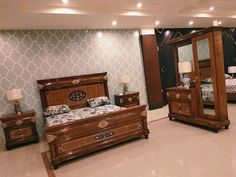 a bedroom scene with focus on the bed, dresser and armoire in the foreground