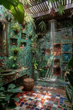 a bathroom with green tiles and plants in the shower area, surrounded by greenery