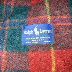 a label on the back of a plaid jacket that says, ralph lauren polo club