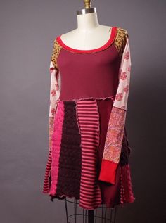 a mannequin wearing a red and pink dress