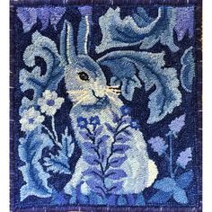 an image of a blue and white rabbit with flowers on it's back ground