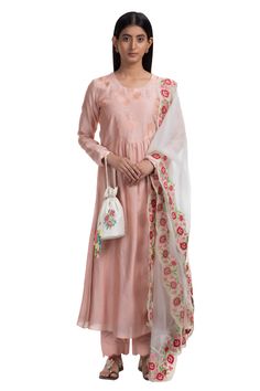 Peach anarkali with floral embroidery and round neck. Comes with scallop edged straight pants and off white dupatta.
Component: 3
Embroidered
Neckline: Round
Sleeve Length: Full
Fabric: Kurta: Handwoven Chanderi; Pants: Cotton; Dupatta: Silk Organza 
Color: Peach
Embroidered scallop edged dupatta
Straight fit pant with scallop edged hem
Note: Potli shown in the image is not for sale - Aza Fashions Off White Dupatta, Peach Anarkali, Latest Dress Design, Straight Fit Pants, Cotton Dupatta, Silk Set, Pants Cotton, Organza Dupatta, Embroidered Neckline