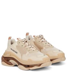 There’s something about Balenciaga’s Triple S sneakers that hits a contemporary nerve. From its chunky 6.5mm soles that seamlessly blend track, running and basketball cues in one style, to its leather-free composition and overt (we want to say deconstructive) display of the sizing at the toes, the original dad sneaker – here updated in beige – continues to keep us treading on a higher plane of cool. Shoes For Wedding Guest, Balenciaga Triple S Sneakers, Balenciaga Bracelet, Nude Sneakers, Shoe Storage Solutions, Balenciaga Sneakers, Dad Sneakers, Balenciaga Shoes, Stylish Boots