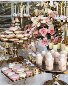 a table topped with lots of desserts and pastries