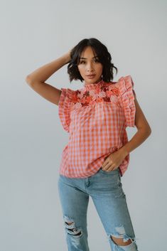 We're upping our wardrobe game with this top! Gingham print Floral detailing Flutter sleeve Keyhole back 100% cotton Model is 5'5" and wearing a size small. XS: 0-2 Small: 2-4 Medium: 6-8 Large: 10-12 Summer Cotton Top With Butterfly Sleeves, Summer Cotton Tops With Butterfly Sleeves, Cotton Butterfly Sleeve Top For Summer, Cotton Flutter Sleeve Top For Brunch, Spring Cotton Blouse With Flutter Sleeves, Feminine Top With Smocked Back And Flutter Sleeves, Summer Cotton Top With Ruffled Collar, Casual Cotton Top With Butterfly Sleeves, Summer Cotton Tops With Ruffled Collar