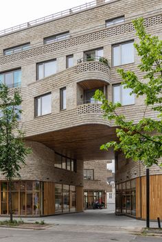 the building is made of bricks and has many windows