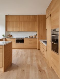 a kitchen with wooden cabinets and white counter tops