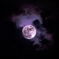 the full moon is shining brightly in the night sky