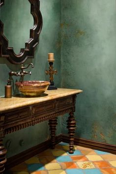 a bathroom with a sink, mirror and tiled flooring in the middle of it