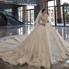 a woman in a wedding dress is posing for the camera