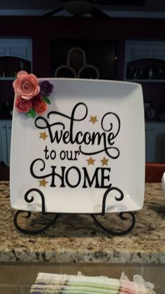 a welcome sign is sitting on top of a counter