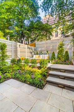 an outdoor garden with steps leading up to it