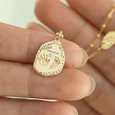 💞The Baby Handprint and Footprint Necklace is a precious keepsake, meticulously crafted in 10K/14K/18K solid gold and PT950 to capture a lifetime of memories. Available in size：14*16mm. Each piece embodies the cherished bond between parent and child. ❣Side stones: Upgradeable to diamond for a fee of $99. or upgrade to natural gemstone for a fee of $39.   Customizable with engravings on both sides, this necklace offers a truly personal touch. Whether it's your baby's actual footprints or handprints, significant dates, or names, you can personalize it to commemorate your most treasured moments. Ideal for new parents or as a heartfelt gift for loved ones, this necklace is a timeless treasure that will be cherished for years to come. Capture the essence of love and joy with this exquisite pie Footprint Necklace, Gift For Newborn, Baby Handprint, Gold Baby, Baby Comforter, Handmade Jewelry Gift, Tiny Hand, Keepsake Jewelry, Baby Keepsake