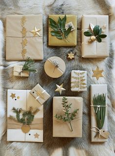 christmas presents wrapped in brown paper and tied with twine, pine cones, evergreen leaves, starbursts