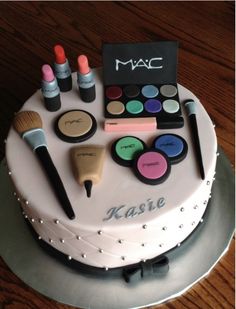 a cake with makeup and cosmetics on it