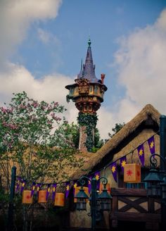 a tall tower with a clock on it's side