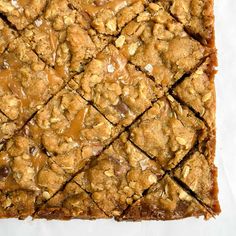 a close up of some food on a white table top with brown sugar and caramel