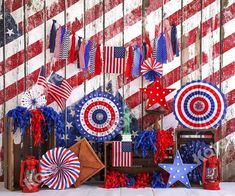 an american flag backdrop with red, white and blue decorations