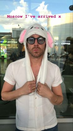 a man wearing a bunny hat and sunglasses