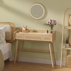 a bedroom with a bed, table and mirror