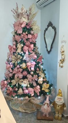 a decorated christmas tree with pink and gold decorations