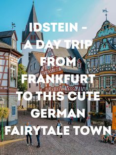 an old town with people walking around it and the words insein - a day trip from frankfurt to this cut german fairy tale town