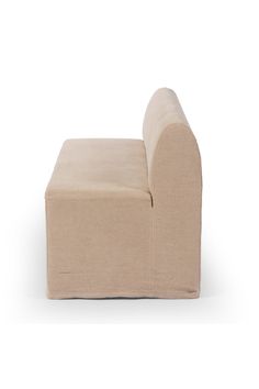 a small beige chair on a white background