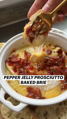 a person dipping something into a bowl of food with bread in the background and text overlay that reads pepper jelly prosciutto baked brie