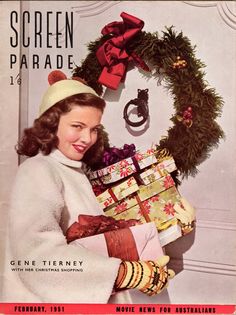 an old magazine cover with a woman holding presents