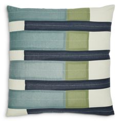 a blue and green pillow on a white background