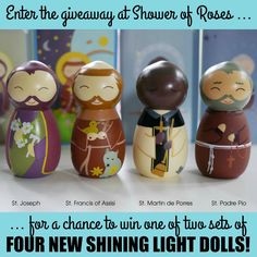 three small wooden dolls sitting next to each other with the caption enter the giveaway at shower of roses for a chance to win one of five sets of four new shining light dolls