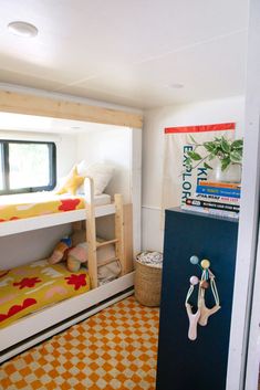 there is a bunk bed in this small room