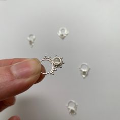 "These are soooooo pretty. Made is 925 sterling silver with tribal details, set with a grounding smokey quartz stone. The rings are all 1cm (.40\") in diameter. The wire is 20 gauge. Each piece is made BY HAND so there may be very slight differences One of the images contains numbers to specify which you would like from the drop down menu." Sterling Silver Septum Ring, Nickel-free Sterling Silver Septum Ring, Bohemian Sterling Silver Septum Ring As Gift, Dainty Handmade Silver Nose Ring, Dainty Silver Pierced Nose Rings, Unique Silver Septum Ring, Silver Open Ring Septum As Gift, Dainty Silver Nose Rings, Silver Open Ring Septum Gift