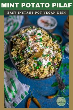 a bowl filled with rice and peas on top of a blue table