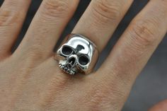 Our classic silver skull ring is a staple in your skull ring collection, hand crafted from sterling silver. This bold statement piece captures the spirit of risk-taking and embraces unapologetic attitude. Show off your style and set yourself apart with this unique and captivating ring, a great look on both men and women. Originally hand carved from wax, now cast into silver, we size each one of our skull rings by hand to fit you perfectly. Each and everyone of our rings are finished by hand with Black Skull Ring, Skull Engagement Ring, Mens Skull Rings, Silver Skull Ring, Skull Rings, Skull Face, Classy Aesthetic, Skull Jewelry, Diy Rings